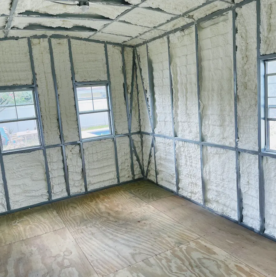 Closed-cell spray foam insulation applied to wall cavities in a residential project in Williamsville